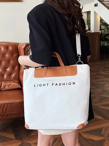 Large white canvas tote bag with brown leather trim and Light Fashion text print