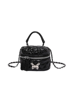 Quilted black mini box bag with silver butterfly buckle and chain strap on white background