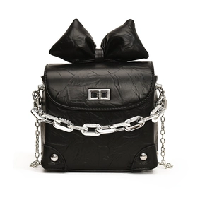 Mini black crossbody bag with oversized bow, chunky silver chain and twist lock detail