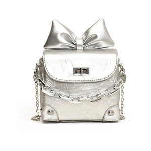 Mini silver chain bag for women with large bow detail and stylish wrinkled texture finish