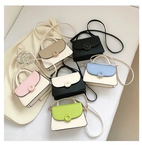 Collection of six bicolor square bags in various colors on a soft beige background