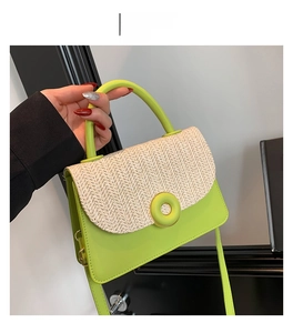 Detail of green PU leather and beige straw patchwork texture on stylish square crossbody bag