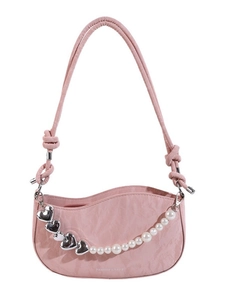 Pink textured leather shoulder bag with white pearl chain and silver heart charms