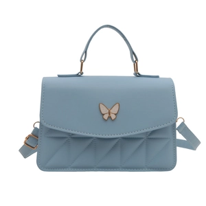 Minimalist light blue crossbody handbag for women with white butterfly buckle and quilting