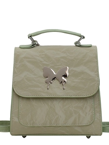 Elegant pale green handbag with pleated texture and silver butterfly accent for women