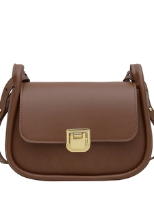 Brown caramel crossbody bag with gold square lock and diamond quilted leather pattern