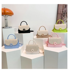 Detail of diverse woven crossbody handbags in six colors on minimalist white podiums