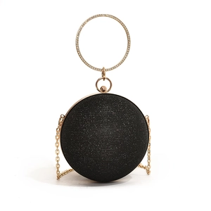 Sparkly black spherical evening bag with rhinestone-embellished gold handle and chain