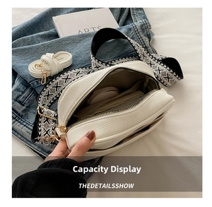 White lychee leather crossbody bag with geometric wide strap and spacious interior compartments