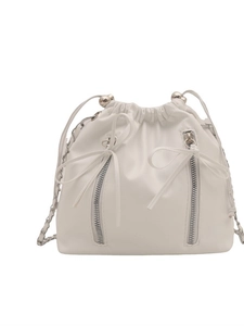Minimalist white bucket backpack with chain strap and bow detailing on a clean background
