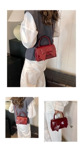 Three-way view of wine red bow handbag showing handheld and shoulder carrying styles