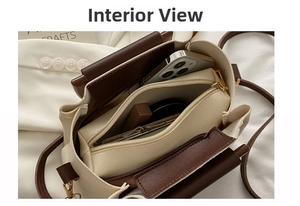 Detail view of the interior layout showing compartments for phone and lipstick in the bag