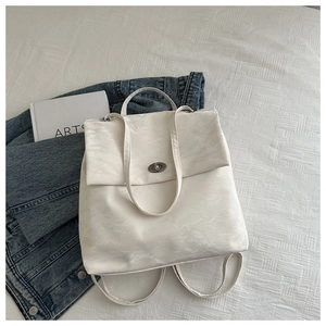 Detail of white marble pattern soft leather backpack with silver rotating metal lock