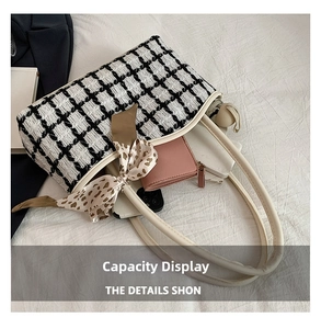 Internal view of the checkered tote bag showing large capacity for phone and wallet