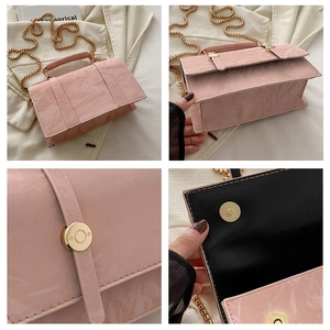 Detail of pink marble pattern handbag with golden chain strap and magnetic metal clasp