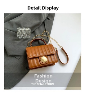 Close-up of caramel quilted bag with vertical stripes and golden metal round buckle