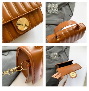 Detail view of brown quilted leather bag with gold magnetic buckle and chain strap