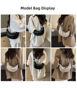 Detail view of black and silver croissant shoulder bags with knot-accented straps