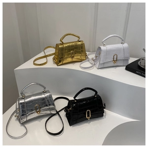 Mini trapezoid handbags with crocodile texture and metal buckle in gold, silver, black, and white