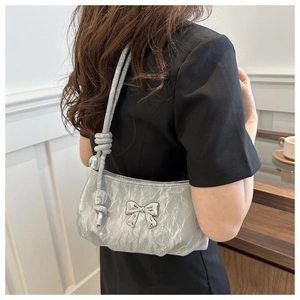 Silver metallic pleated shoulder bag with a 3D bow and transparent beaded strap details