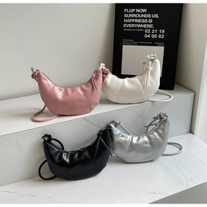 Minimalist crescent moon bags in pink white black and silver with pleated soft leather texture