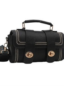 Elegant black leather handbag with dual gold twist locks and floral embroidery accents