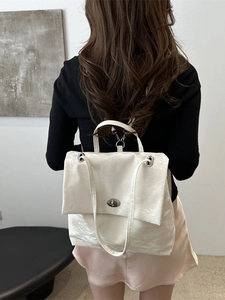 Minimalist creamy white pleated leather shoulder bag with silver chain and metal clasp