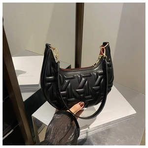 Detail of black crescent hobo bag with quilted texture and gold metal zipper hardware