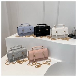 Collection of retro chain crossbody bags in five colors with textured faux leather finish