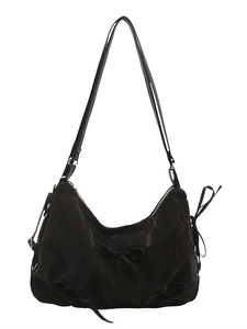 Black bow-decorated crescent hobo bag made of nylon with adjustable shoulder strap