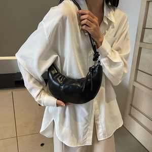Minimalist black leather croissant shoulder bag with pleated design for daily commute