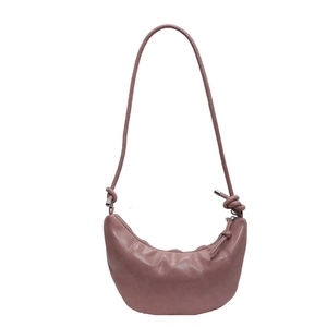 Pink crescent croissant shoulder bag with vertical stitching and knotted strap detail