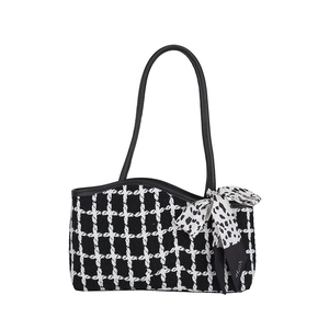 Classic black and white checkered tweed tote bag with elegant leopard print bow detail