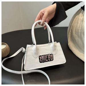 White crocodile pattern handbag with ZMIEBO embroidery and adjustable shoulder strap