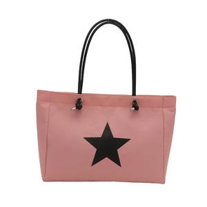 Pink tote bag with black star print and long handles for daily student commute