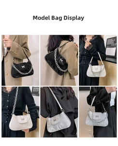Detail view of marble pattern shoulder bags with butterfly lock and metal chain accessories