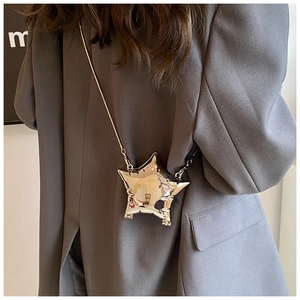 Star-shaped metallic mini crossbody bag with a sleek silver finish and long chain strap