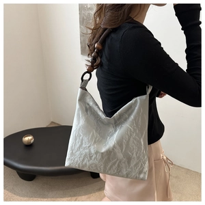 Chic silver velvet pleated shoulder bag with artistic dark wooden bead strap detail