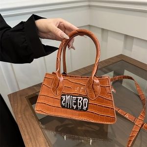 Caramel crocodile pattern crossbody bag with ZMIEBO embroidery and top handles