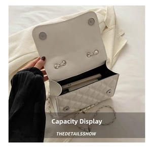 Detailed internal view of white quilted crossbody bag showing daily essentials capacity