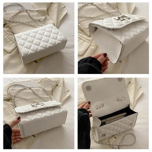 Detail of white quilted handbag with silver bow accent and woven chain strap