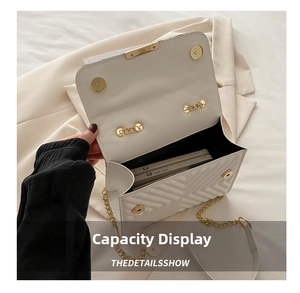 Internal view of the white quilted chain bag showing capacity for two smartphones