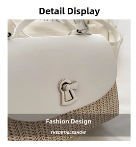 Detail of woven straw and white leather crossbody bag with silver metal swivel lock