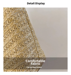 Macro detail of the natural woven texture and durable straw fibers of the tote bag