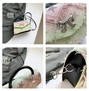 Makro-Detail der Stofftasche mit Sternmuster und großer silberner Metallschnalle