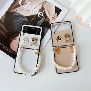 Samsung Galaxy Z Flip case with faux leather, metal heart, bear charm and pearl strap
