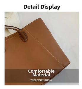 Macro detail of caramel brown tote bag with premium synthetic leather and white contrast stitching