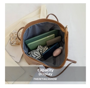 Macro view of spacious brown tote bag interior with zipper and daily essentials