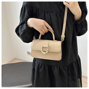 Minimalist beige crossbody box bag with gold U-shaped buckle and versatile shoulder strap