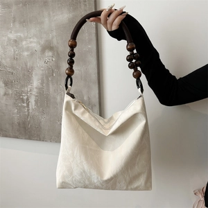 Chic cream ruched shoulder bag with handcrafted wooden bead woven strap for women
